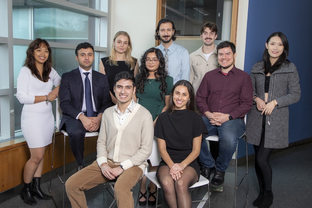 A group of young adults smiling at the camera.